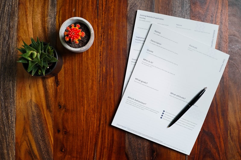Desk with papers, pen and coffee representing document review
